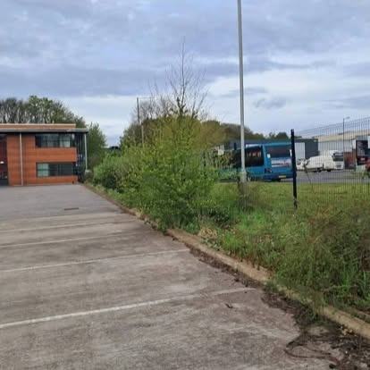Office car-park border cleared — before CRJ Gardening & Grounds